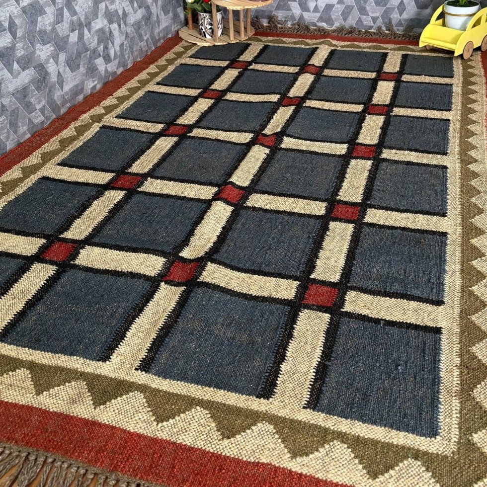 Alfombra kilim de yute de lana con borde rojo